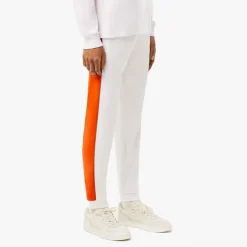 Trousers*Lacoste Tapered Leg Sweatpants in white orange
