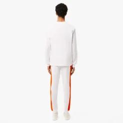 Trousers*Lacoste Tapered Leg Sweatpants in white orange