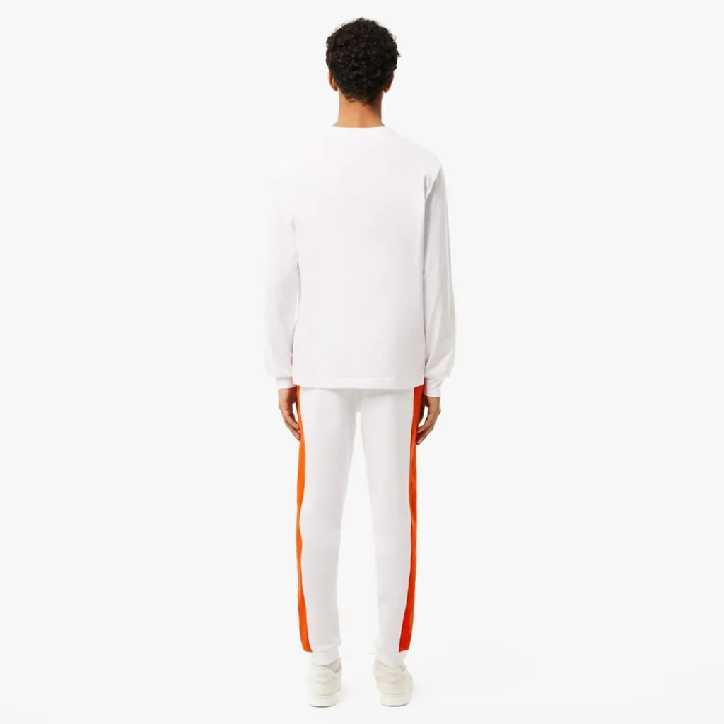 Trousers*Lacoste Tapered Leg Sweatpants in white orange