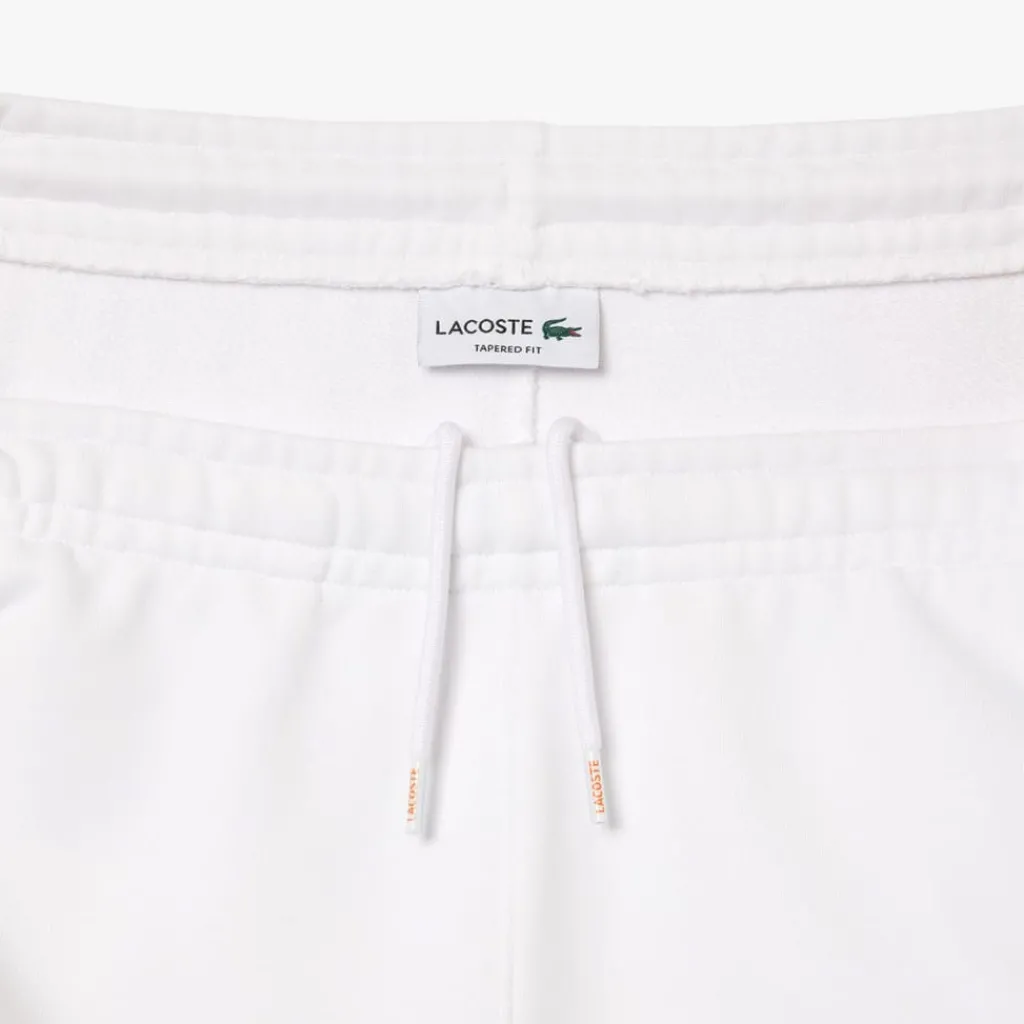 Trousers*Lacoste Tapered Leg Sweatpants in white orange