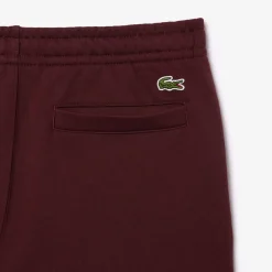 Trousers*Lacoste Tapered Leg Sweatpants in red maroon