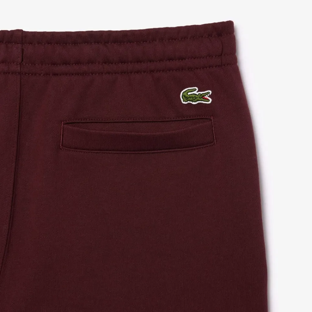 Trousers*Lacoste Tapered Leg Sweatpants in red maroon